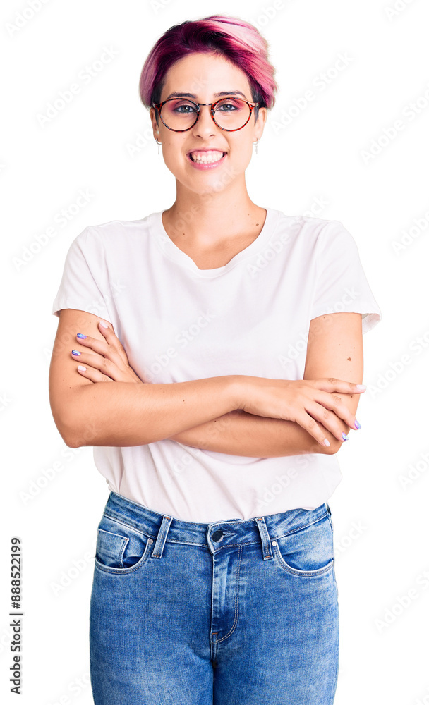 Young beautiful woman with pink hair wearing casual clothes and glasses happy face smiling with crossed arms looking at the camera. positive person.