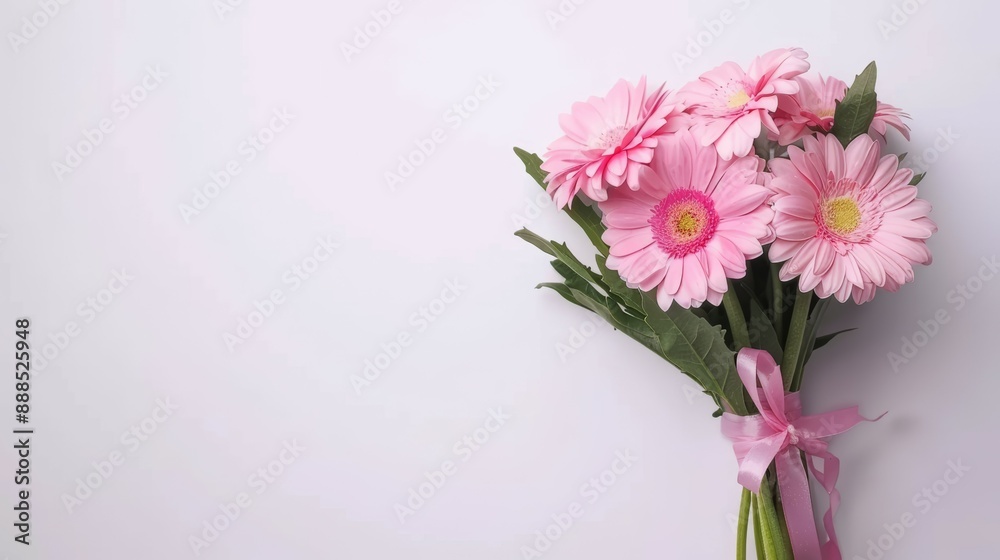 A bouquet of pink flowers is displayed on a white background A bouquet of pink flowers is displayed on a white background