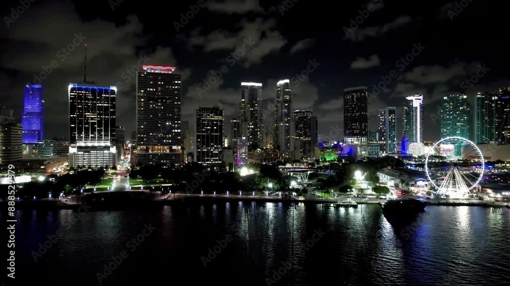 Night Downtown At Miami Florida United States. Aerial View Of A Bustling City With High-Rise Buildings And Traffic. Building Town Sky Clouds Illuminated Urban. Illuminated City Landmark. Night Downtown At Miami Florida United States. Aerial View Of A Bustling City With High-Rise Buildings And Traffic. Building Town Sky Clouds Illuminated Urban. Illuminated City Landmark.