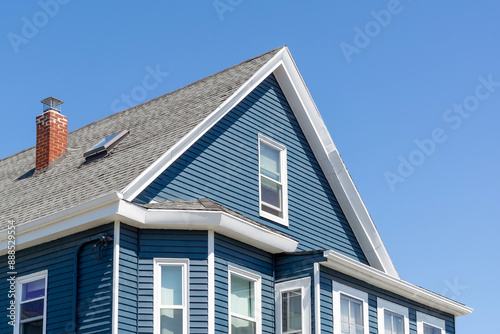 Billede på lærred Blue Sided Gable Roofed House Against Clear Sky in Boston, Massachusetts, USA