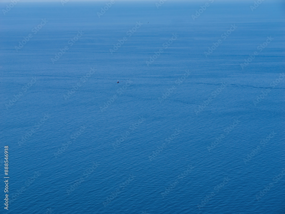 A luxury private helicopter hovers over the Mediterranean Sea, showcasing Mallorca's crystal waters and the exclusivity of air travel. A luxury private helicopter hovers over the Mediterranean Sea, showcasing Mallorca's crystal waters and the exclusivity of air travel.