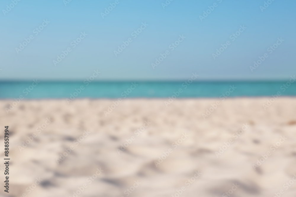 Blurred view of beautiful sandy beach and sea on sunny day. Summer vacation Blurred view of beautiful sandy beach and sea on sunny day. Summer vacation