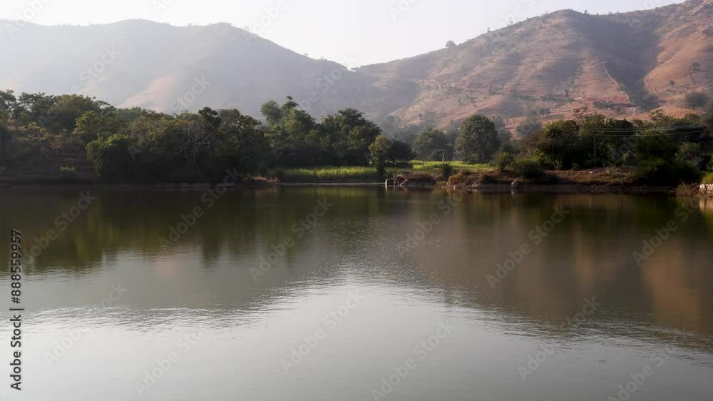 isolated pristine lake with water reflection at morning from flat angle isolated pristine lake with water reflection at morning from flat angle