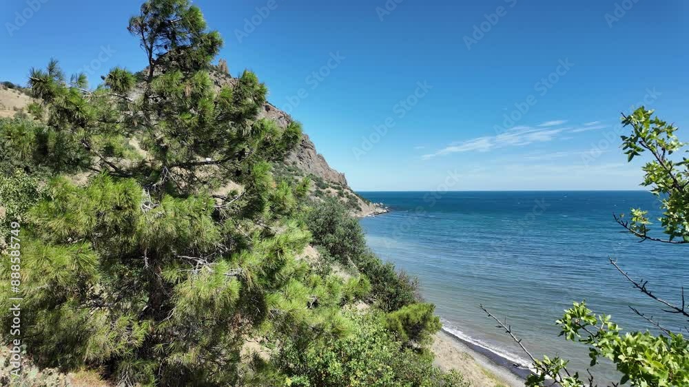 The Black Sea coast of Crimea, Russia, is a stunning place with lush greenery and blue waters. The Black Sea coast of Crimea, Russia, is a stunning place with lush greenery and blue waters.