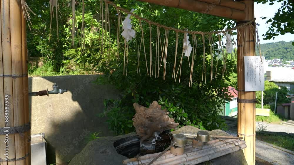 Beautiful and typical Chozu water ladle at shrine in Japan Beautiful and typical Chozu water ladle at shrine in Japan