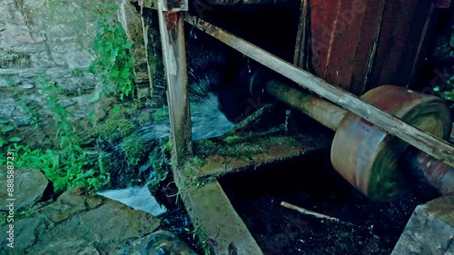 Wallpaper Mural Water power force turns shaft with spinning grindstone at old rustic mill Torontodigital.ca