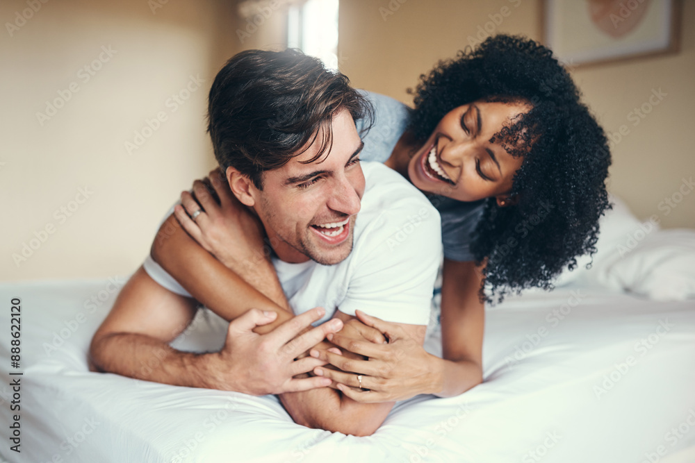 Fototapeta premium Happy, man and woman in bedroom for relax, morning and support for partner in apartment. Smile, couple and excited in home for marriage, respect and together on weekend for laughing, humour and joke