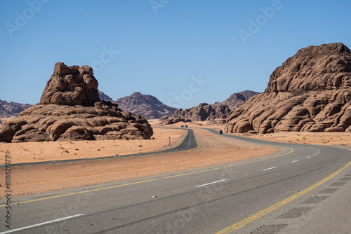 Tabuk, Saudi Arabia: The stunning red desert road near Tabuk in northwestern part of Saudi Arabia in the middle east on a sunny day