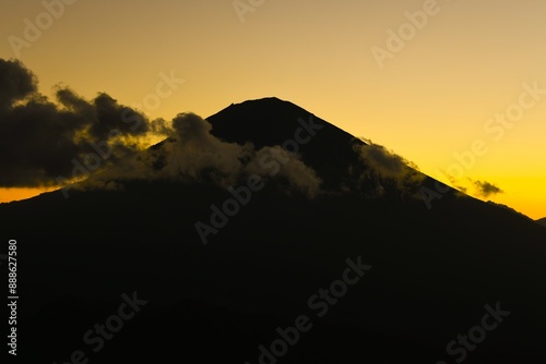 Scenic view of Mount Agung (the highest point on Bali, 3031 m) taken at sunset from the Lahangan Sweet viewpoint located in east Bali (Kecamatan Abang Subdistrict, Karangasem Regency, Bali, Indonesia) photo