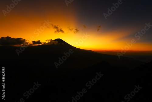 Scenic view of Mount Agung (the highest point on Bali, 3031 m) taken at sunset from the Lahangan Sweet viewpoint located in east Bali (Kecamatan Abang Subdistrict, Karangasem Regency, Bali, Indonesia) photo