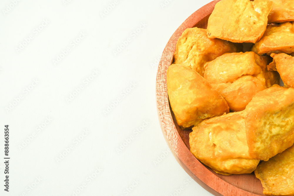Tahu Takwa is tofu that has a yellow color by soaking tofu in turmeric water. Fried yellow tofu is a specialty food from Kediri, East Java, Indonesia. Concept for Plant based protein - Flat Lay Photo Tahu Takwa is tofu that has a yellow color by soaking tofu in turmeric water. Fried yellow tofu is a specialty food from Kediri, East Java, Indonesia. Concept for Plant based protein - Flat Lay Photo