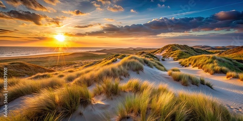 Fototapeta Naklejka Na Ścianę i Meble -  Sunset casting a warm glow over the dunes of Schoorl , sunset, dunes, Schoorl, evening, sand, nature, landscape, beauty