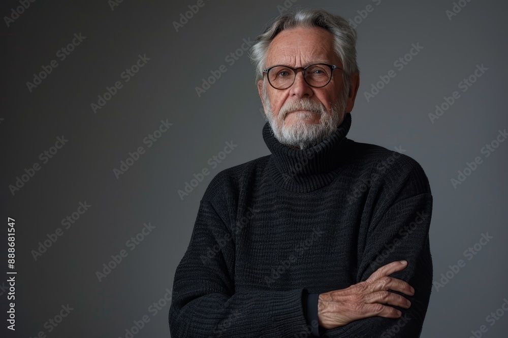 Photo of elderly man in sweater with crossed arms on grey background Photo of elderly man in sweater with crossed arms on grey background