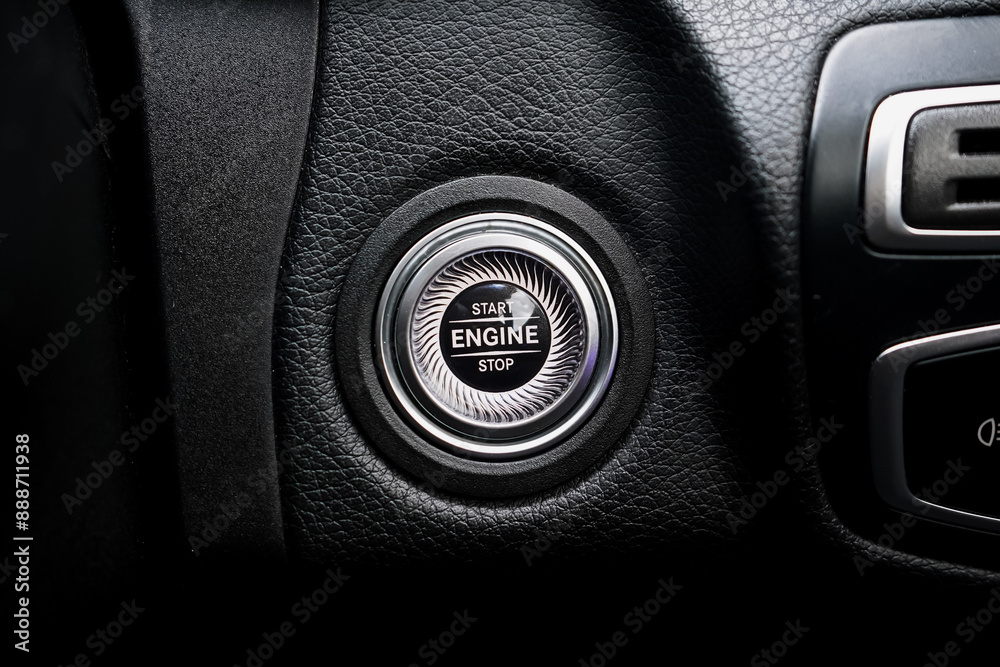 Close up engine car start button. Start stop engine modern new car button,Makes it easy to turn your auto mobile on and off. a key fob unique ,selective focus Close up engine car start button. Start stop engine modern new car button,Makes it easy to turn your auto mobile on and off. a key fob unique ,selective focus
