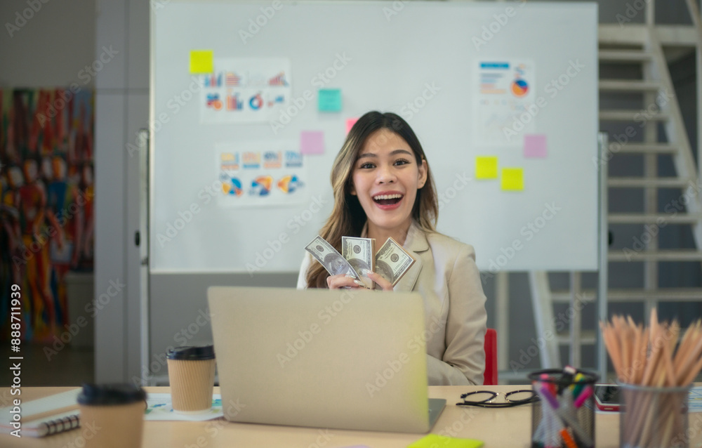Financial Advisor Holding Dollar Bills with Business Charts Showing Financial Success and Growth. Financial Advisor Holding Dollar Bills with Business Charts Showing Financial Success and Growth.