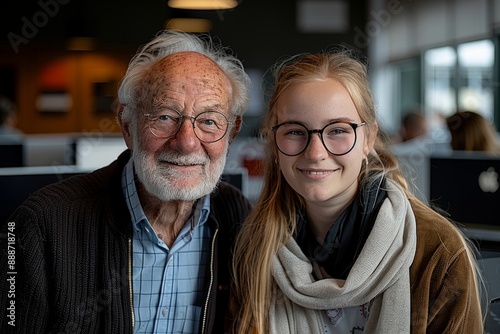 Happy Young Adults and Senior Mentors Collaborating in Technology and Coding Projects