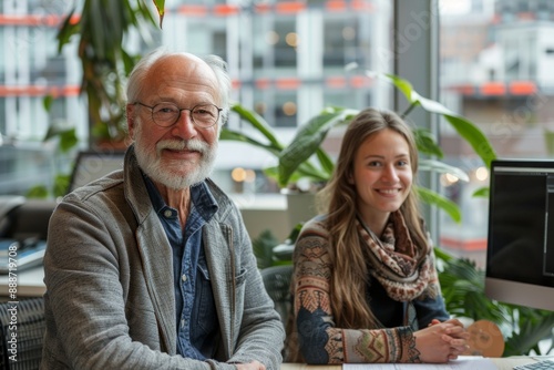 Happy Young Adults and Senior Mentors Collaborating in Technology and Coding Projects