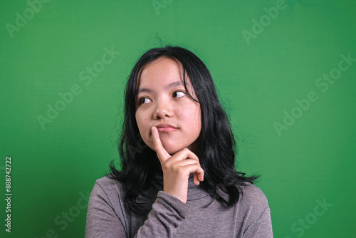 Young Asian Woman With Thinking Gesture, Confuse to Decide. © Gatot