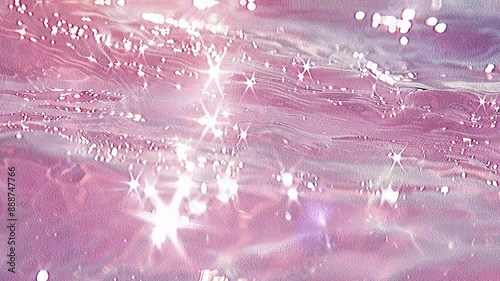 Abstract background. Beach water is pink. Light pink and orange pastel aesthetic water texture with sunlight reflection. Pink clear water. Pink water bubbles on the surface ripples. Pink liquid water