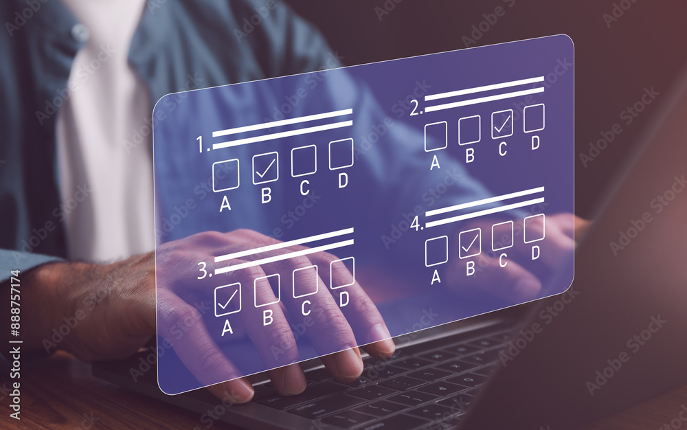 Businessman using laptop filling online survey exam Choosing the right answer in the exam, filling out an online survey form. Online test or exam, pass exam on internet, choose correct answer.