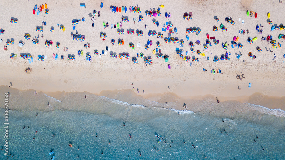 Aerial view pepole travel and vacation on sandy beach and blue sea water, Sandy beach colorful umbrella with people tourist swimming, Tropical seascape turquoise water travel and vacation. Aerial view pepole travel and vacation on sandy beach and blue sea water, Sandy beach colorful umbrella with people tourist swimming, Tropical seascape turquoise water travel and vacation.