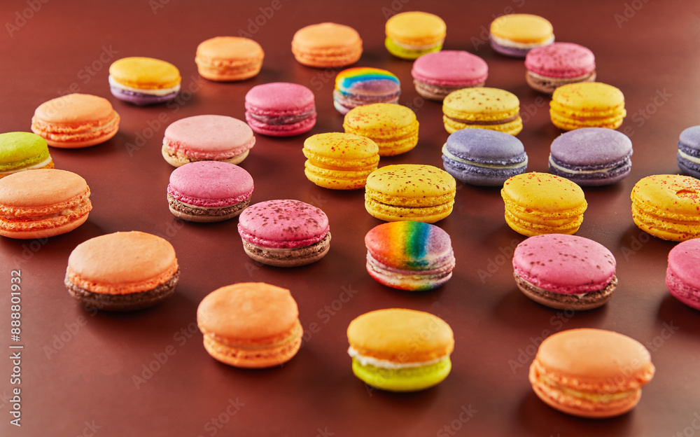 Colorful macarons on a chocolate background Colorful macarons on a chocolate background