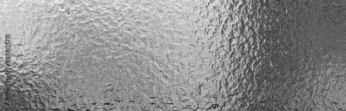 Metal matte rippled background. Abstract metal foil texture	
