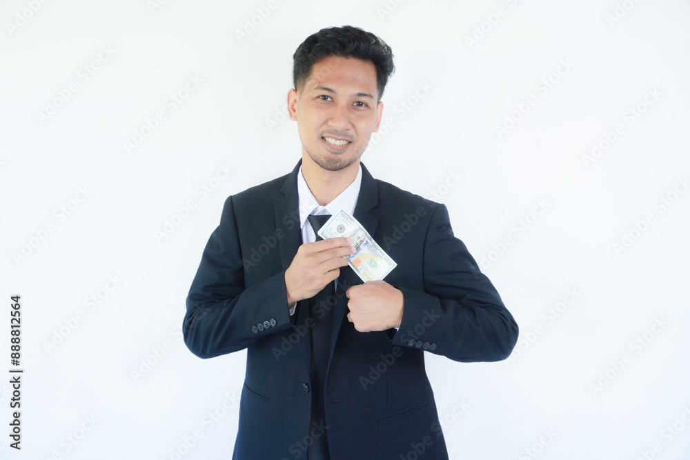 Man putting bribe money into pocket on white background, Concept for corruption, finance profit, bail and crime Man putting bribe money into pocket on white background, Concept for corruption, finance profit, bail and crime