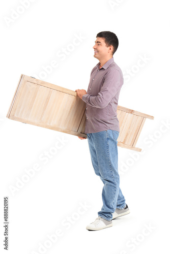 Young man carrying folding ...