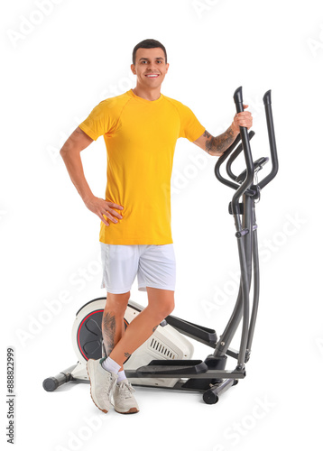 Sporty young man near exerc...