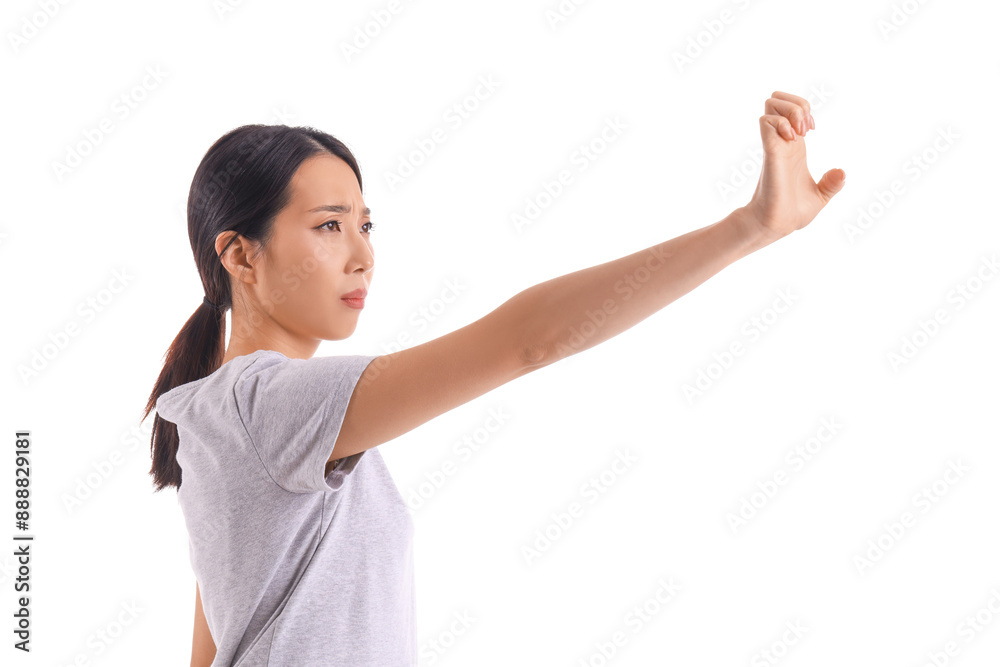 Young Asian woman practicing martial arts on white background Young Asian woman practicing martial arts on white background