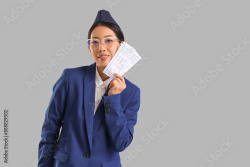 Young Asian stewardess with...