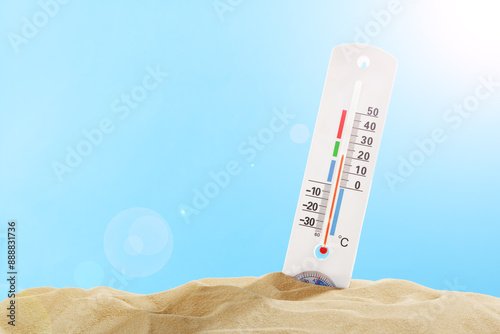 Thermometer Measuring High Temperature in Sand on Sunny Day