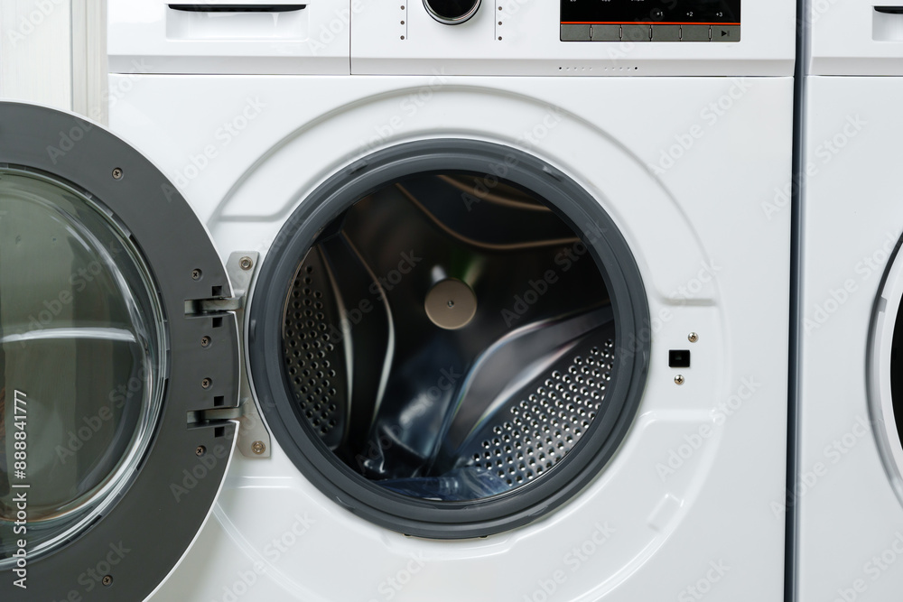 White Washing Machine With Open Door in a Laundry Room White Washing Machine With Open Door in a Laundry Room