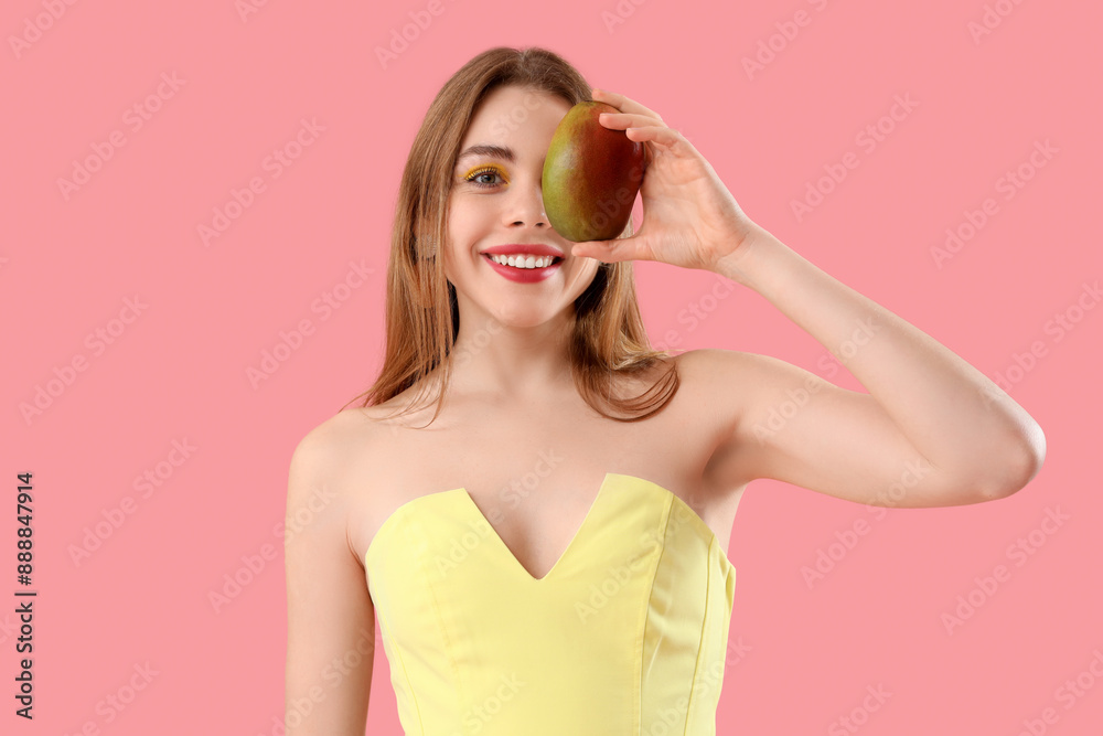 Happy young woman with sweet mango fruit on pink background Happy young woman with sweet mango fruit on pink background
