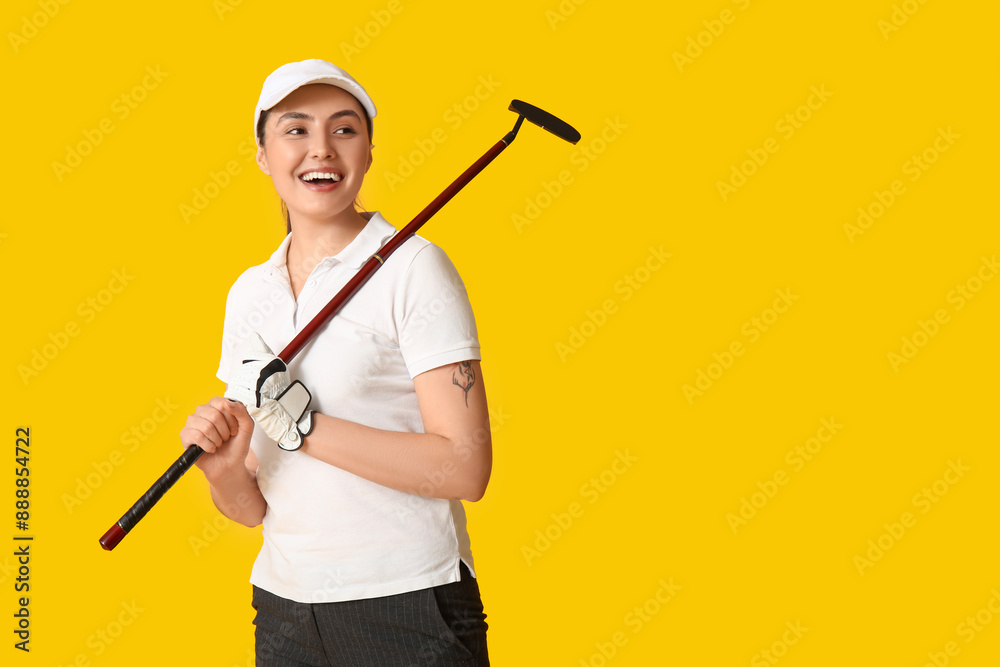Beautiful female golfer on yellow background Beautiful female golfer on yellow background