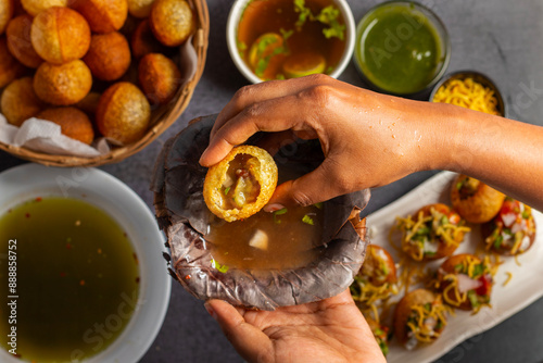 Exploring the Tangy, Spicy, and Refreshing Delight of Pani Puri. India's Favourite Street Food Experience. Selective focus. 