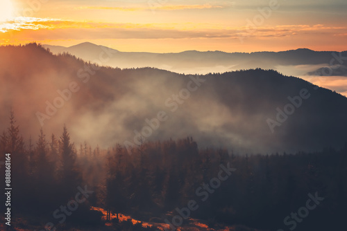 Canvas Print A beautiful sunrise over a misty mountain range