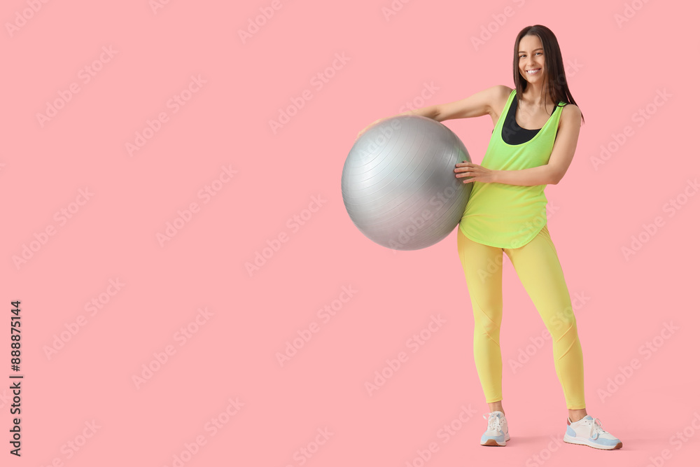 Sporty young woman with fitball on pink background Sporty young woman with fitball on pink background