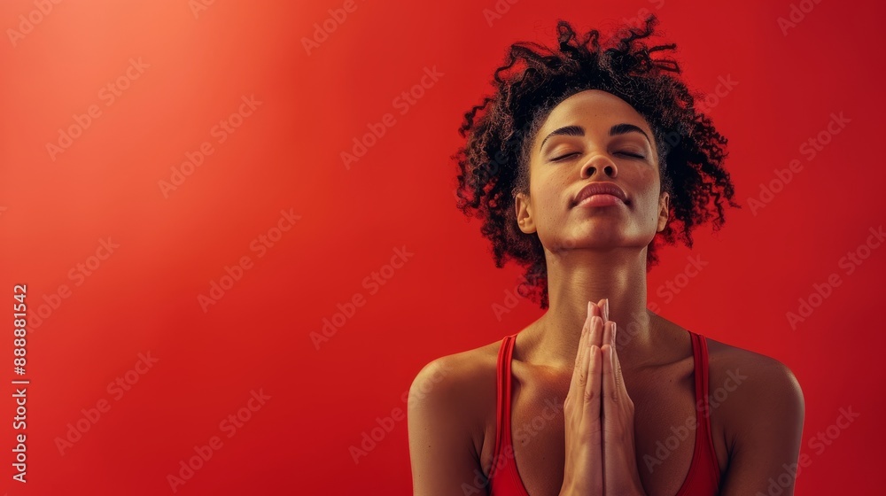 Person doing yoga pose on red background Person doing yoga pose on red background