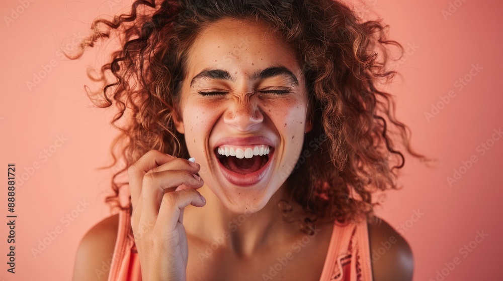 Person grimacing while taking bitter medicine on peach background Person grimacing while taking bitter medicine on peach background