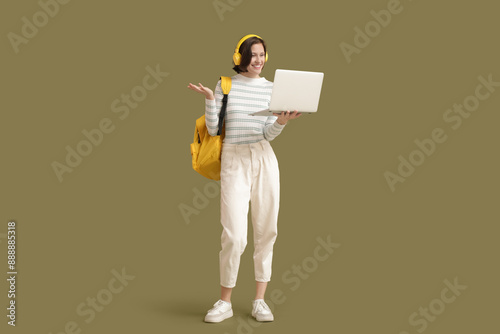 Beautiful student in headph...