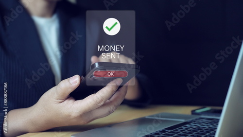 Obraz na plátně Businesswoman holding phone with text money sent on screen display,Wireless electronic digital transaction transfer