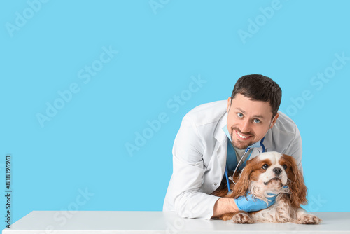 Male veterinarian with cute...