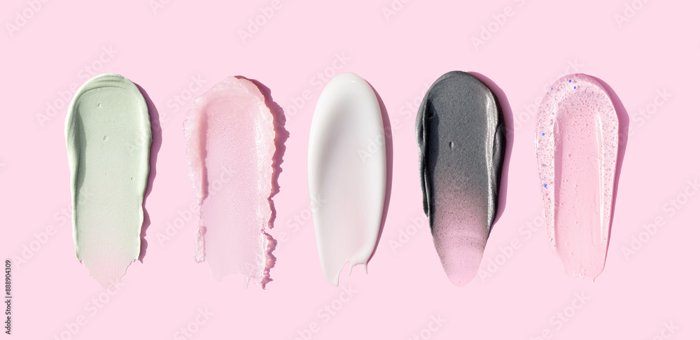creamy texture of cosmetic samples on pink background creamy texture of cosmetic samples on pink background