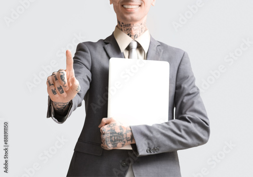 Young businessman with lapt...