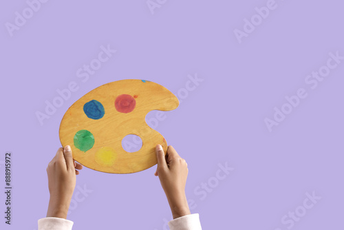 Child with paint palette on...