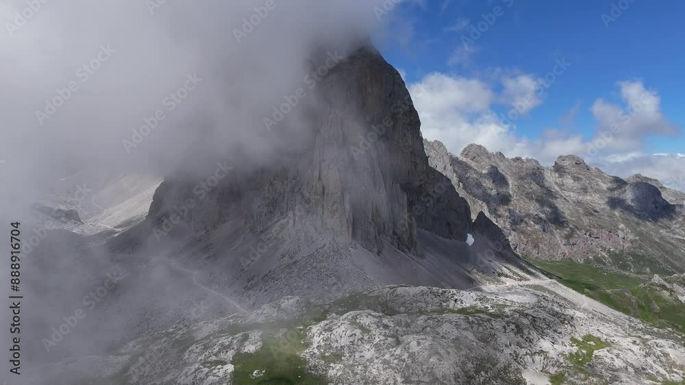 Clouds drifting reveal of high mountain peak Picos de Europa Spain Clouds drifting reveal of high mountain peak Picos de Europa Spain