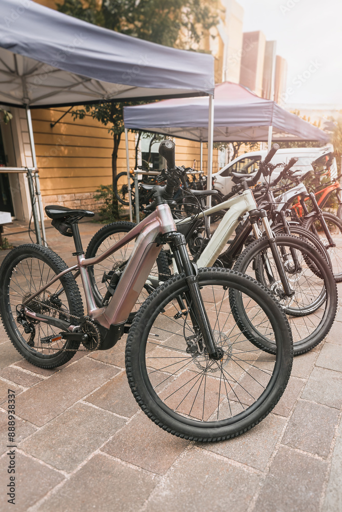 Obraz premium Electric Bikes Parked Outside Urban Shop