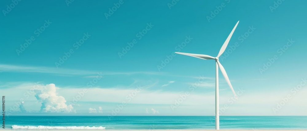 A wind turbine atop a sandy beach, facing the ocean under a clear, blue sky A wind turbine atop a sandy beach, facing the ocean under a clear, blue sky